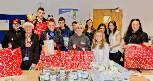 KHT apprentices and residents from Octavia Court with the keep warm hampers they have put together for Knowsley Housing Trust's:- 'Keep Warm' campaign. 